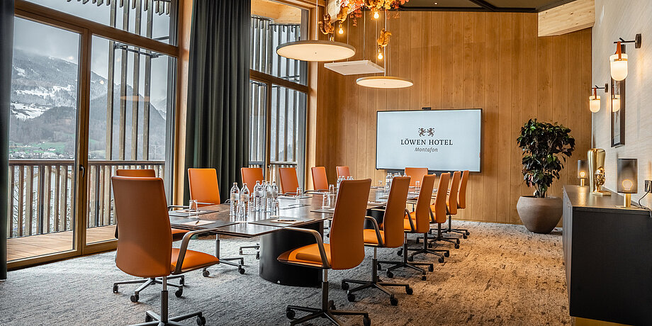 The conference room in the Löwen Hotel Montafon with a modern office furniture and beautiful mountain view