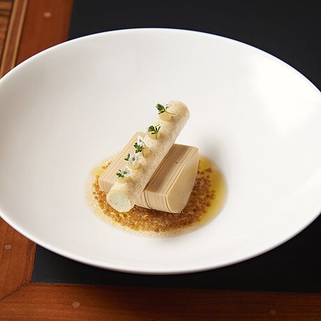 A goose liver was served on a white plate at the Löwen Hotel Montafon