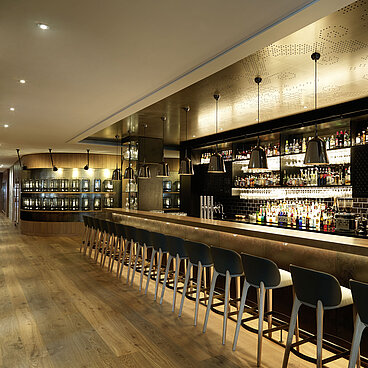 Interior shot of our fireplace bar and a row of the chairs at the counter